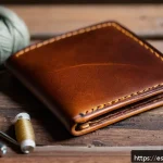 Home 23 콤부차 가죽을 활용한 가정용품 제작 - A close-up image of a handcrafted wallet made from kombucha leather, showing the unique fibrous text...